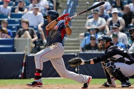 Red Sox center fielder Mookie Betts hit a single during a spring training game against the Yankees.
