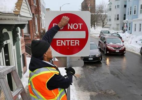 Workers installed new ?Do Not Enter? signs on South Boston streets in February.
