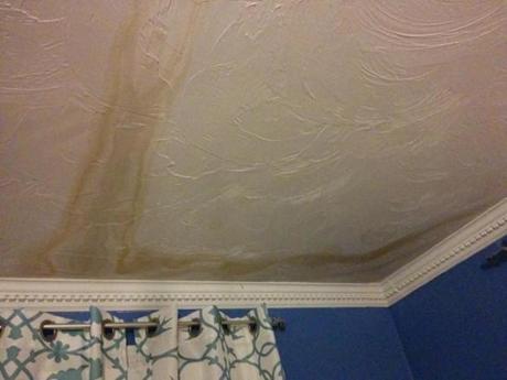 Water that slipped under an ice dam stained this bedroom ceiling.
