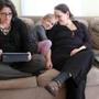 Michelle Lauder (left) and Susan Kane with their 6-year-old daughter, Adar, carve out family time away from computer screens.