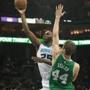 Mar 30, 2015; Charlotte, NC, USA; Charlotte Hornets center Al Jefferson (25) shoots the ball around Boston Celtics center Tyler Zeller (44) during the first half at Time Warner Cable Arena. Mandatory Credit: Jeremy Brevard-USA TODAY Sports