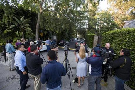 Members of the media wait outside the home of Andrew Getty in the Hollywood Hills area of Los Angeles.
