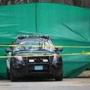 Police stood by a Biogen building near Kendall Square on Saturday after a bag of human remains was discovered outside the company building.