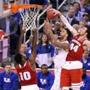 INDIANAPOLIS, IN - APRIL 04: Willie Cauley-Stein #15 of the Kentucky Wildcats goes up with the ball against Nigel Hayes #10 and Frank Kaminsky #44 of the Wisconsin Badgers in the second half during the NCAA Men's Final Four Semifinal at Lucas Oil Stadium on April 4, 2015 in Indianapolis, Indiana. (Photo by Joe Robbins/Getty Images)
