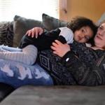 In St. Albans, Vt., Stephanie Robtoy, sober for six months, rested at home with her daughter, Aubriella, 3.