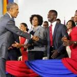 President Obama greeted students at the University of the West Indies in Kingston, Jamaica, on Thursday as he arrived at a town hall meeting.