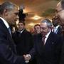President Obama and Cuban President Raul Castro shook hand Friday at a summit meeting in Panama.