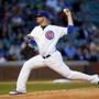Chicago Cubs starting pitcher Jon Lester (34) throws a pitch against the Cincinnati Reds during the first inning of a baseball game in Chicago, on Monday, April 13, 2015. (AP Photo/Jeff Haynes)