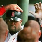 7-2-95:Fenway Park:Mo Vaughn, who after the game was named to the American League All-Star team, gets high fives from teammates in the dugout following the first of his two home runs on the day, this one coming in the third inning. Library Tag 03072011