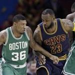 Marcus Smart drove past LeBron James as Brandon Bass provided a block during a game Friday in Cleveland.