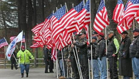 Flags were  held in honor at the funeral of Spc. John M. Dawson. 
