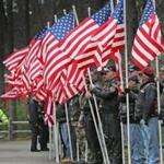 Flags were  held in honor at the funeral of Spc. John M. Dawson. 