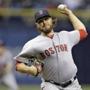 Boston Red Sox starting pitcher Wade Miley delivers to the Tampa Bay Rays during the first inning of a baseball game Tuesday, April 21, 2015, in St. Petersburg, Fla. (AP Photo/O'Meara) 