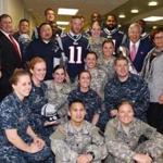A contingent from the Patriots visited with military personnel at Walter Reed National Military Medical Center.