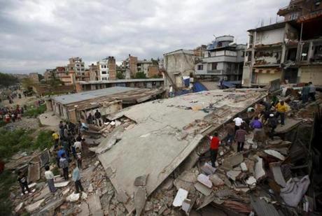 Residents gathered near a collapsed house in Kathmandu. 
