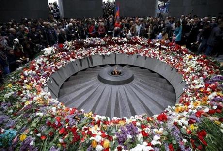  People attend a commemoration ceremony to mark the centenary of the mass killing of Armenians by Ottoman Turks at the Tsitsernakaberd Memorial Complex in Yerevan, Armenia, on April 24. The Armenian Apostolic Church on Thursday made saints of up to 1.5 million Armenians at an open air ceremony to commemorate their killing. (David Mdzinarishvili/Reuters)
