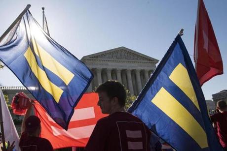 Supporters of same-sex marriage gathered outside the Supreme Court on Tuesday to demonstrate support for LGBT couples.
