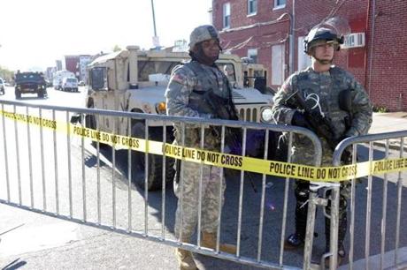National Guard troops stood at a street checkpoint in Baltimore on Tuesday.
