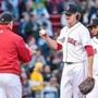 04/28/2015 BOSTON, MA Pitcher Clay Buchholz (cq) is taken off the mound in the bottom of the third during a game between the Boston Red Sox and the Toronto Blue Jays at Fenway Park in Boston. (Aram Boghosian for The Boston Globe) 