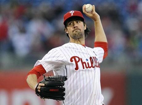 Philadelphia Phillies starting pitcher Cole Hamels throws a pitch during the first inning of a baseball game against the Washington Nationals, Saturday, April 11, 2015, in Philadelphia. (AP Photo/Michael Perez)
