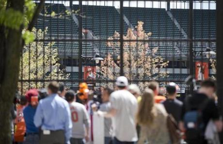 Fans watched through a fence outside Camden Yards on Wednesday.
