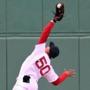 Boston-04/29/15- Boston Red Sox vs Toronto Blue Jays- Sox center fielder Mookie Betts makes a great over the shoulder catch on a 3rd inning long fly ball hit by Toronto's Devon Travis. He manages to keep the ball in the web of the glove despite hitting the wall. Boston Globe staff photo by John Tlumacki (sports)
