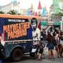 The images of boxers Floyd Mayweather and Manny Pacquiao adorn a merchandise selling truck as pedestrian walk past on May 1, 2015 in Las Vegas, Nevada one day before the 