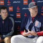 Boston Red Sox Executive Vice President and General Manager Ben Cherington, left, listens as manager John Farrell responds to a question during a news conference at the teams baseball spring training facility in Fort Myers Fla., Saturday Feb. 21, 2015. The Red Sox extended manager Farrell's contract on Saturday through the 2017 season, with a team option for 2018. (AP Photo/Tony Gutierrez)