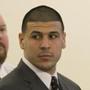 Former New England Patriots NFL football player Aaron Hernandez, center, stands with his defense attorneys, from left, Charles Rankin, Micheal Fee and James Sultan, as the verdict is read in his murder trial, Wednesday, April 15, 2015, at Bristol County Superior Court in Fall River, Mass. Hernandez was found guilty of first-degree murder in the shooting death of Odin Lloyd in June 2013. (/Pool Photo via AP)