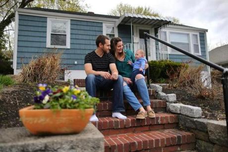 Four years and a lot of paperwork later, Liz and Chris Stuart (pictured with children Harper, 5 months, and Leighton, 3) purchased their Braintree home. 

