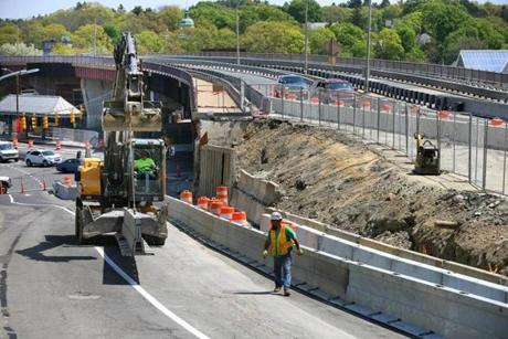 Highway workers set up barricades Saturday to reconfigure traffic lanes at the Casey Overpass in preparation for its demolition, slated for May 18. 
