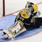 Boston Bruins goalie Niklas Svedberg, of Sweden, stretches as he makes a save against the New York Islanders during the third period of an NHL hockey game in Boston, Thursday, Oct. 23, 2014. The Islanders defeated the Bruins 3-2. (AP Photo/Charles Krupa)