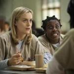 FILE - This image released by Netflix shows Taylor Schilling, left, and Uzo Aduba in a scene from 