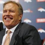 Denver Broncos general manager John Elway jokes with reporters after he talks about the team's selection in the NFL Draft Thursday, April 30, 2015, in Englewood, Colo. The Broncos traded up from the 28th to the 23rd pick to select Missouri pass rusher Shane Ray. (AP Photo/David Zalubowski)