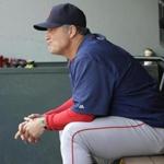 Boston Red Sox manager John Farrell sits in the dugout during the eighth inning of a baseball game against the Seattle Mariners, Sunday, May 17, 2015, in Seattle. The Mariners won 5-0. (AP Photo/Ted S. Warren)
