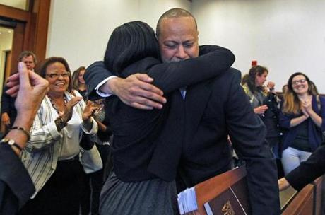 Angel Echavarria (right) hugged his daughter, Ishannis Lopez, after his conviction was vacated by a judge May 18.
