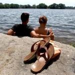 Brandon Cunningham and Amanda Koval basked in the sun Tuesday at Spy Pond in Arlington.