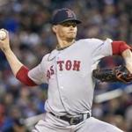 Red Sox starter Clay Buchholz delivers in the first inning. He allowed only two runs in 7 1/3 innings vs. the Twins.