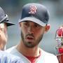 Boston Red Sox catcher Blake Swihart, right, chats with pitcher Rick Porcello in the third inning of a baseball game, Wednesday May 27, 2015, in Minneapolis. (AP Photo/Jim Mone)