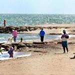 Beach-goers enjoyed the shore in Falmouth earlier this month. 