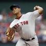Boston Red Sox starting pitcher Eduardo Rodriguez works against the Texas Rangers during the first inning of a baseball game, Thursday, May 28, 2015, in Arlington, Texas. (AP Photo/Brandon Wade)
