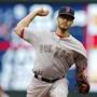 Boston Red Sox pitcher Joe Kelly throws against the Minnesota Twins in the first inning of a baseball game, Monday, May 25, 2015, in Minneapolis. (AP Photo/Jim Mone)