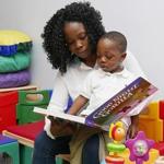 Rose Quoi, 19, of Brockton, reads to her 2-year-old son, Marquis.