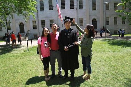 Joey Kim with (from left) his sister, Jessica, father, T.K., and mother, Julie, in Harvard Yard. 
