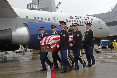 The remains of Cpl. Elmer Richard arrived at Logan Airport Monday.  
