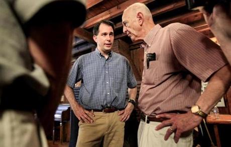 Wisconsin Governor Scott Walker, left, spoke with John Downs after an event in Concord, N.H.
