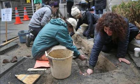 Jessica Dello Russo (right), a 1992 graduate of the Latin School, helped out with the dig in front of the Old City Hall building. 
