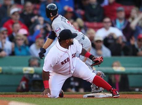 Boston-06/04/15- The Boston Red Sox vs. Minnesota Twins- Sox 3rd baseman Pablo Sandoval watches the thrown ball from catcher Blake Swihart go into the outfield on an error in the 9th inning that had Twins Brian Dozier scoring. He was charged with the error. Boston Globe staff photo by John Tlumacki (metro)
