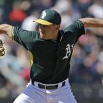 Oakland Athletics' Pat Venditte works against the Chicago White Sox in the fourth inning of a spring training baseball game Sunday, March 8, 2015, in Mesa, Ariz. (AP Photo/Ben Margot)