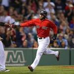 BOSTON, MA - JUNE 5: Dustin Pedroia #15 of the Boston Red Sox celebrates after he scored a run in the fifth inning against the Oakland Athletics at Fenway Park on June 5, 2015 in Boston, Massachusetts. (Photo by Jim Rogash/Getty Images)